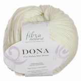 A skein of FIBRA NATURA Dona yarn in beige color with brand label displayed.