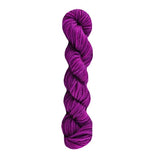 Purple skein of yarn on a white background