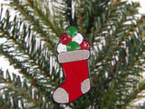 Christmas stocking ornament with colorful candy on a tree